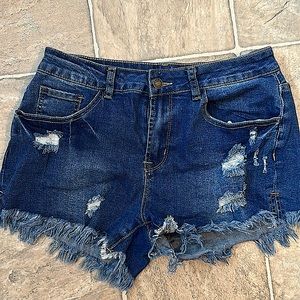 Size medium denim  distressed shorts. With stretch. Like new condition